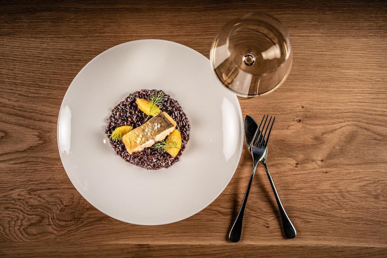 My Arbor - Dolomites Hotel Bressanone Bagian luar foto A plate of black rice risotto