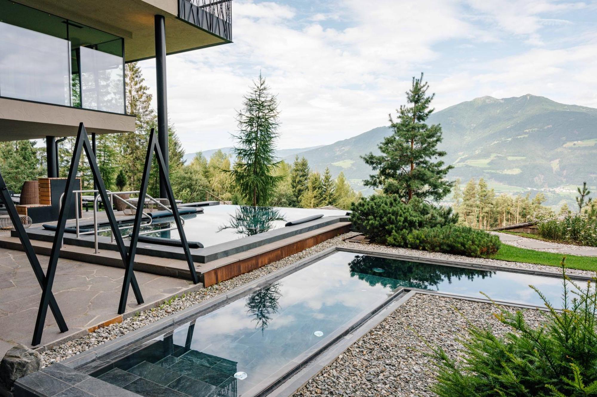 My Arbor - Dolomites Hotel Bressanone Bagian luar foto A private swimming pool in the Alps